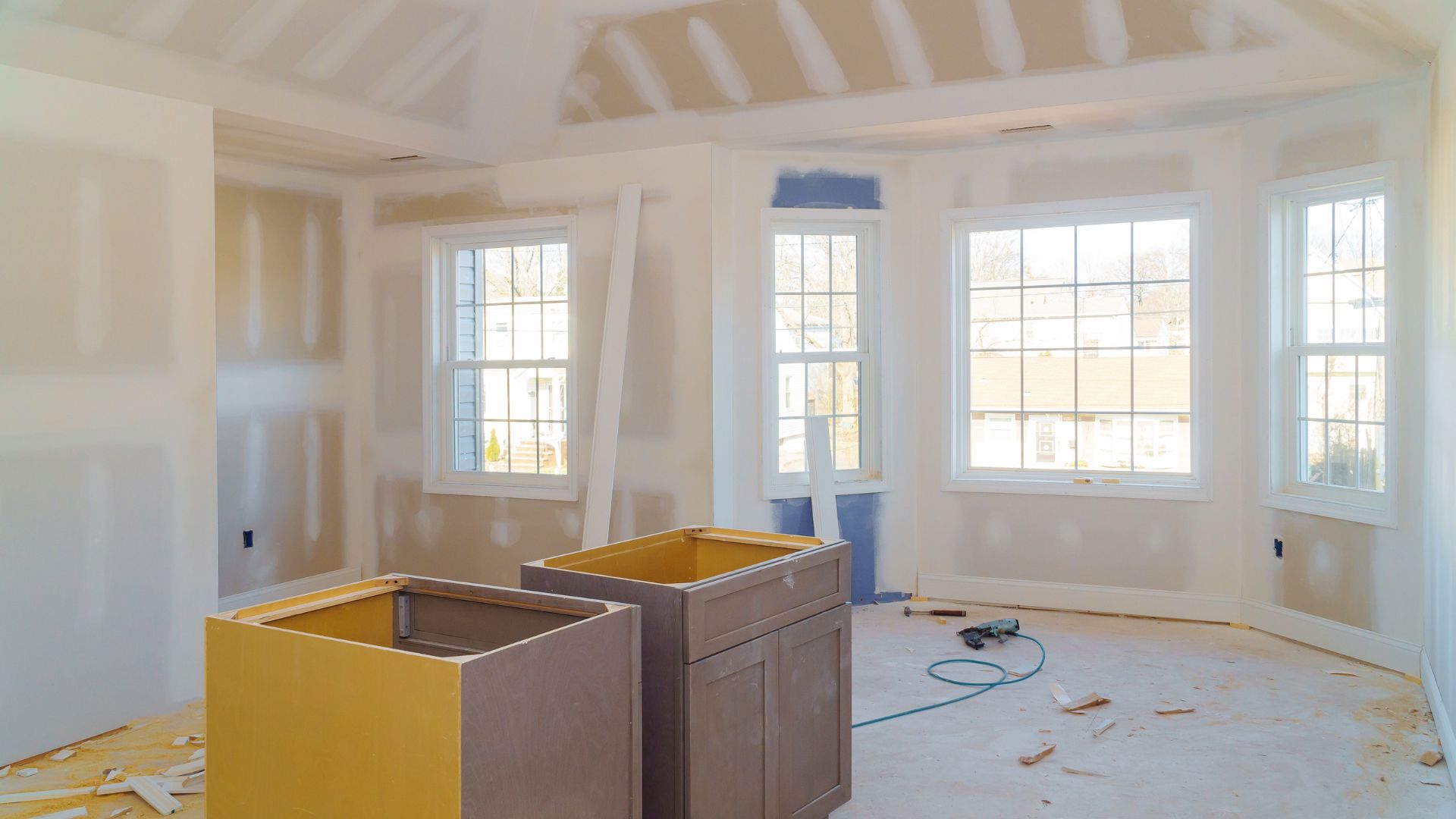 A room that is being remodeled with a lot of paint on the walls