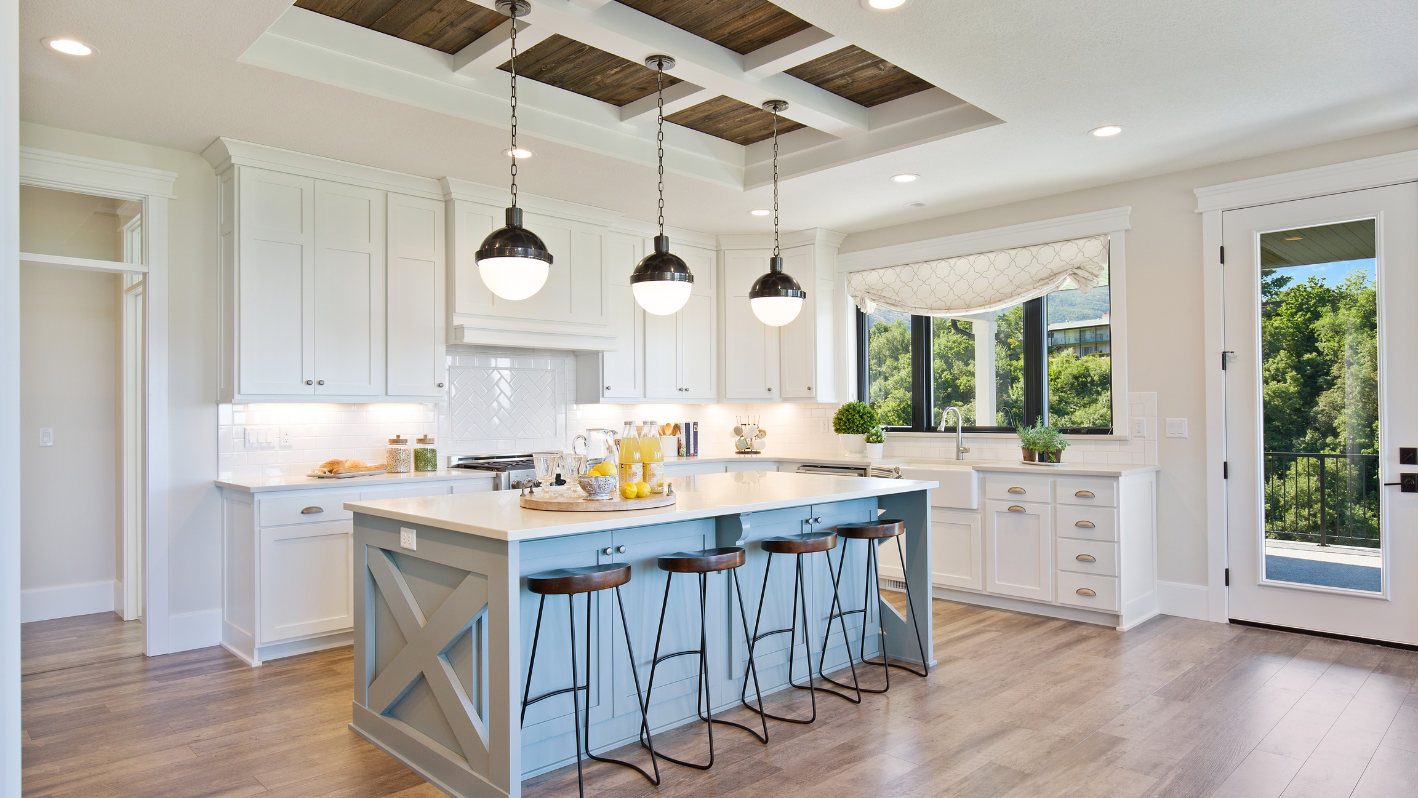 A large kitchen with a center island and bar stools