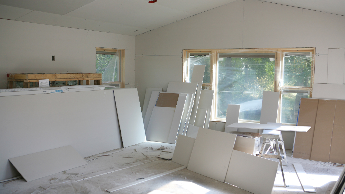 A room that is being remodeled with white walls