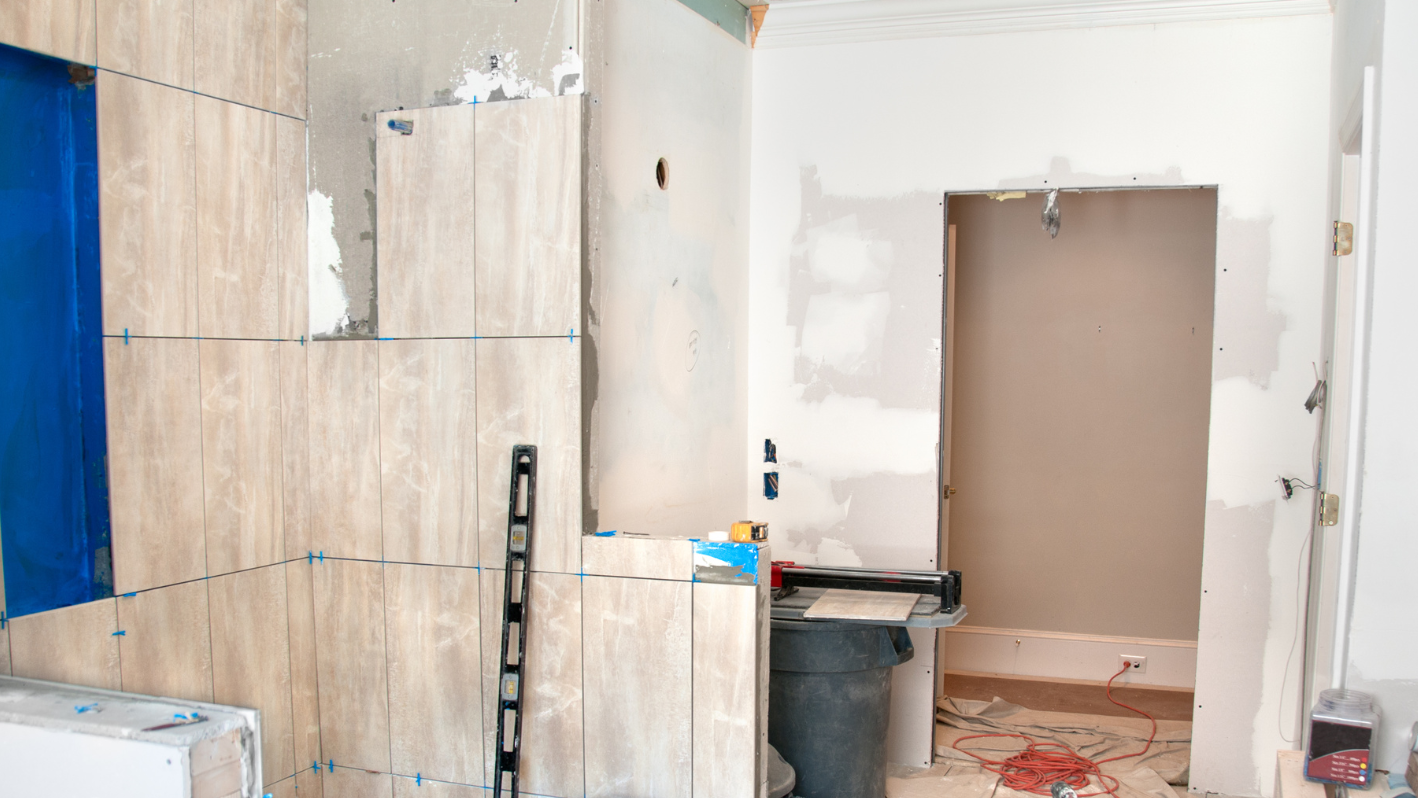 A bathroom being remodeled with a tub and toilet